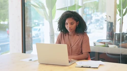 Busy Young African Businesswoman Worker Using Laptop Working in Office