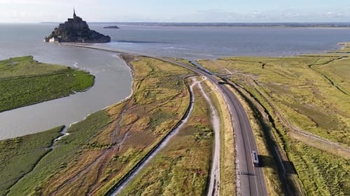 Drone footage of buses coming to and from Mont-Saint-Michel island in France