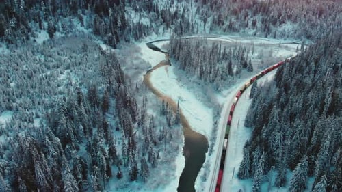 Train Passing By Through Railway In Rogers Pass At Glacier National Park In Canada. Winter In Britis