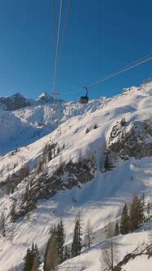 Scenic Gondola Lift to Kaprun Glacier Ski Resort in Winter Alps Mountains