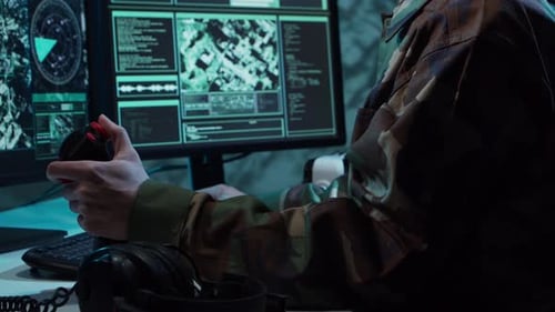 Military Soldier Operating Advanced Technology in a Command Center