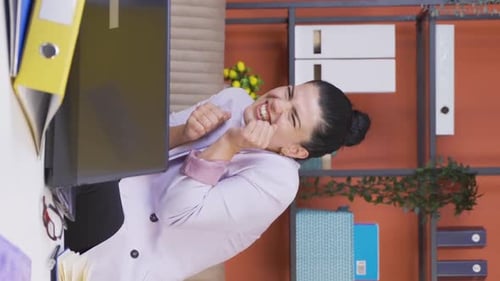 Vertical video of Home office worker woman looking at camera with fear and doubt.