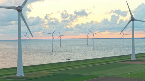 Onshore and offshore wind energy site at sea with high voltage substation