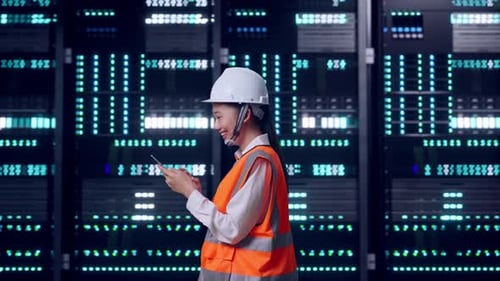 Asian Female Use Smartphone While Walking in Data Center