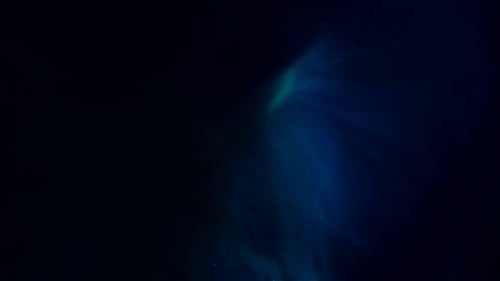 Abstract animation of glowing blue and green elements
