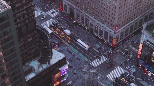NYC: Times Square from above closeup shot of traffic, pedestrians, intersections, billboards and neo