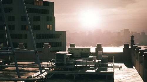Industrial Rooftop Overlooking Modern City at Sunset
