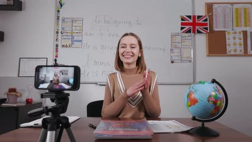Joyful Female Teacher Shooting Video Lesson at School