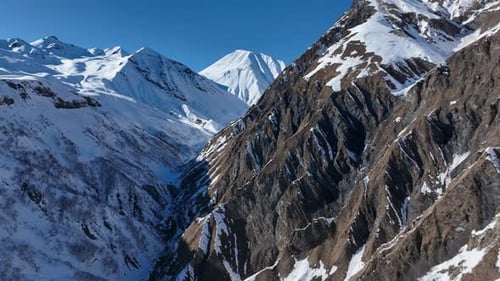 Aerial view of beautiful snowy mountains in Gudauri, Georgia