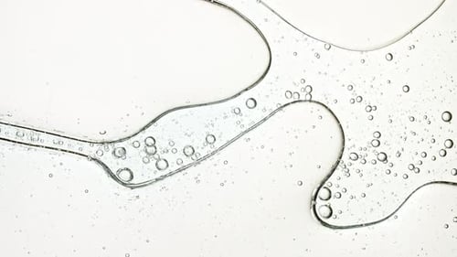 Clear Liquid with Bubbles Close-up Abstract