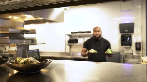 Male Chef Plating and Placing Salads on the Pass in Restaurant 20 Seconds or Greater