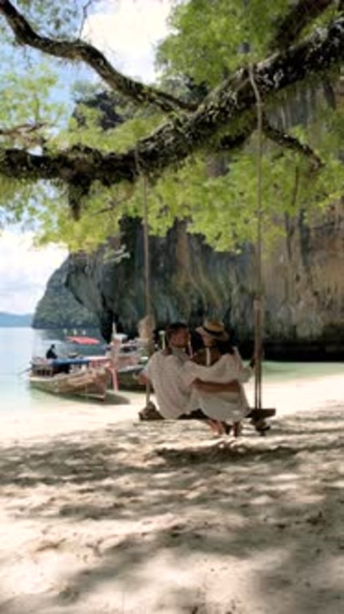 Sunsoaked Couple Relaxing on a Swing at Koh Hong Islands in Krabi Thailand