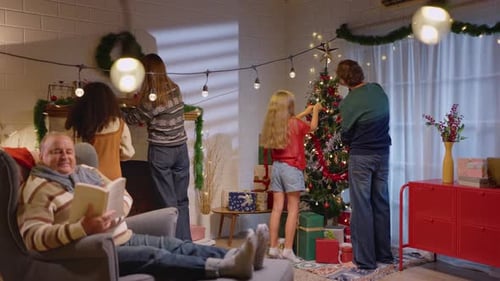 Family Decorating Christmas Tree in Living Room