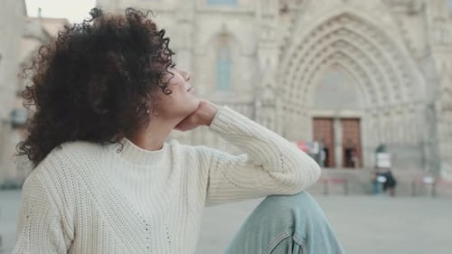 Close-up of a female tourist enjoying beautiful views of the old town square