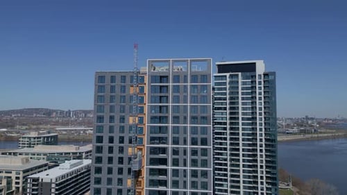 Construction Of Residential Tower With City Skyline At Nuns' Island In Montreal, Quebec, Canada. aer