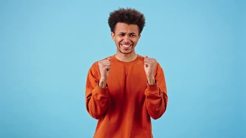 Man Makes Wish Showing Prayer Gesture and Crossing Fingers