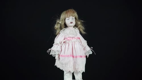 Blonde Porcelain Doll Wearing Pink Lace Dress