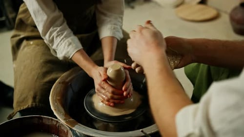 Pottery workshop a potter works with a potter's wheel a product made of clay a potter conducts