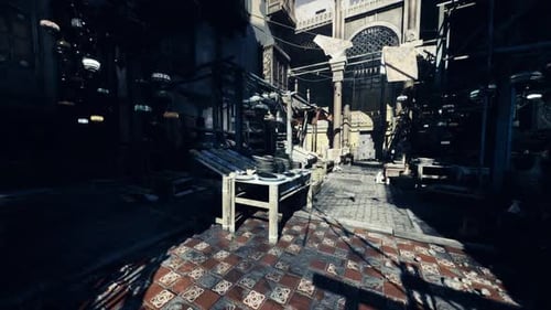 Colorful Market Corridor Filled with Shadows and Lively Movement