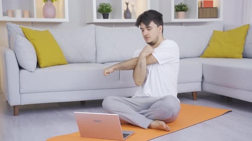 The person who does sports by watching the gym instructor online.