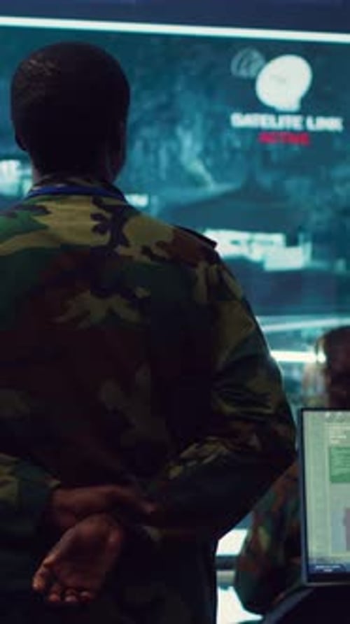 Vertical Video Army Officer Examining Satellite Surveillance Footage on a Big Screen