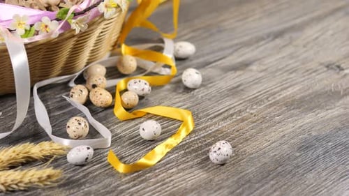 Eggs in Basket Decorated with Ribbons and Flowers Easter Celebration Concept