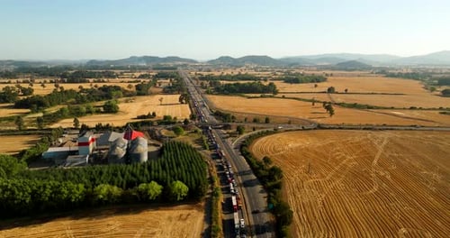Traffic jam on rural highway in Chile. Aerial forward