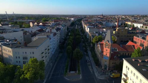 Elevated train running in Berlin at summer. Nice aerial view flight drone