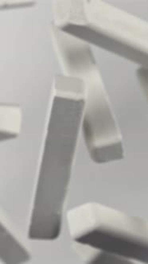 School Chalk Flying on a White Background Filmed on a Highspeed Camera at 1000 Fps