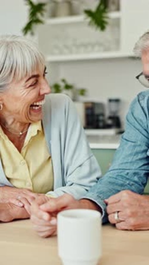 Senior Couple Laughing and Relaxing at Home