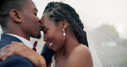 Bride and Groom Embrace at Wedding Celebration