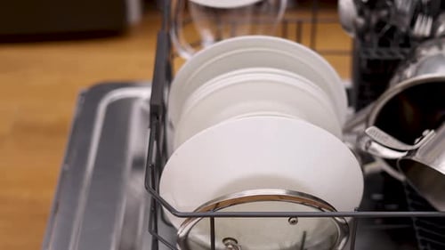 Clean Dishes in a Modern Dishwasher, Close-Up