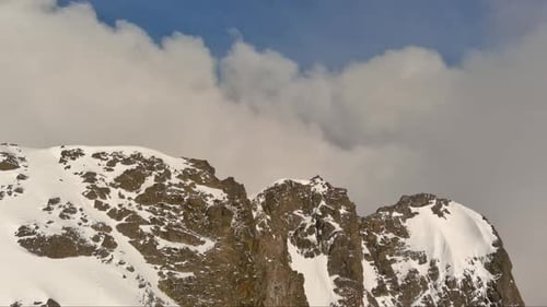 Snowy Mountain Peaks And Clouds. British Columbia, Canada.