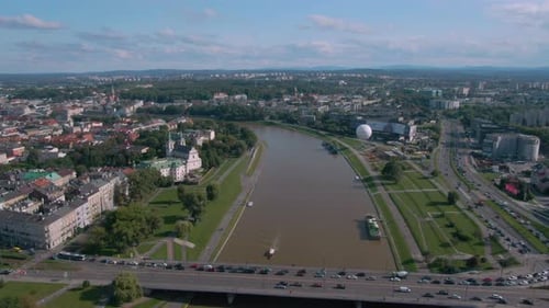 Circling drone shot of bridge over Vistula river in Krakow