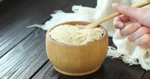 Bowl of Bran Flakes with Wooden Spoon