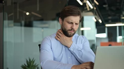 Unhealthy Young Office Worker Getting Flu Virus Symptom at Workplace
