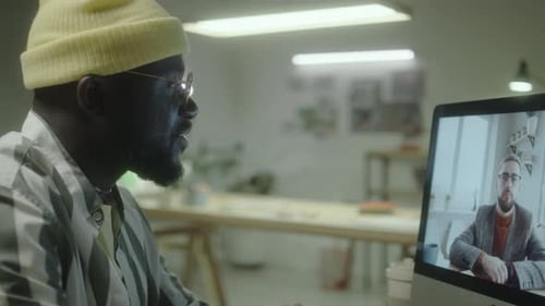 Man Video Conferencing From His Office