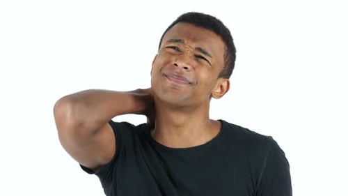 Young Adult Massages Stiff Neck in Studio