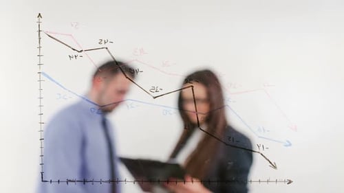 Man and Woman Review Chart in Modern Office