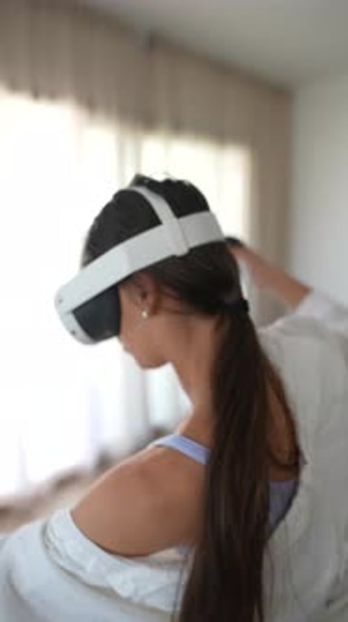 Woman Playing VR Game Indoors with Headset