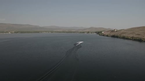 Aerial View of Speedboat with Wake on a Lake