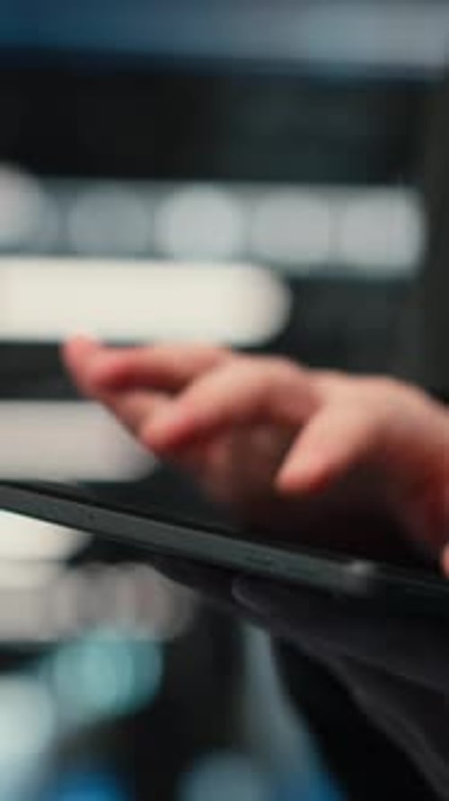 Vertical Video Close Up of Tablet Used By Data Center Admin Troubleshooting Supercomputers