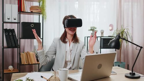 Business Woman Using Virtual Reality Futuristic Technology VR App Headset to Simulation 3D at Office