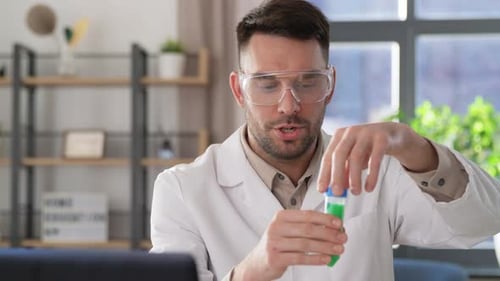 Distance Education, School and Science Concept - Male Chemistry Teacher in Goggles