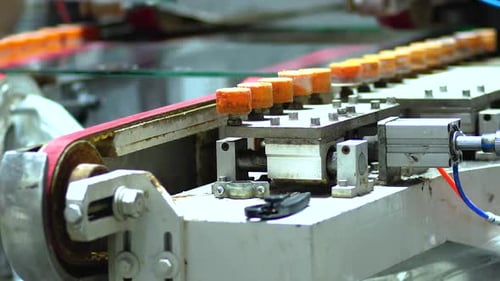 Glass Panes Being Carefully Placed On Converter Belt. Low Angle, Close Up