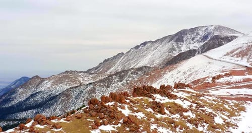 Winding roads through the rocky mountains aerial drone landscape in Colorado