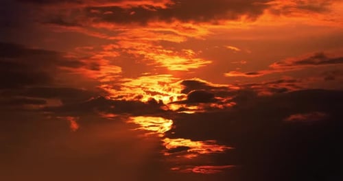 A Timelapse of Moving Clouds at Sunset