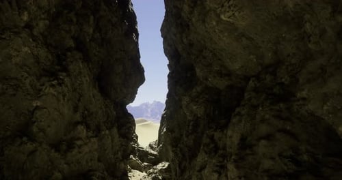 Rock Formation Reveals a Breathtaking View of Mountains and Desert Landscape