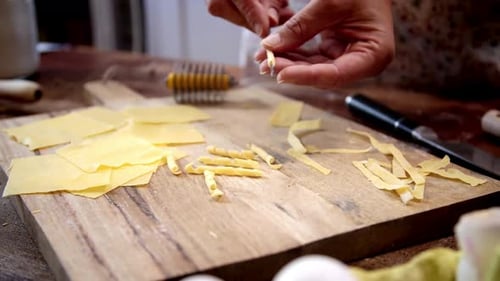 Making Fresh Pasta at Home on Wooden Board