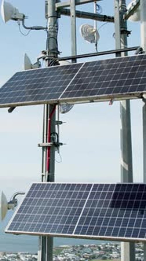 Building, empty and rooftop with solar panels in city for electricity, renewable energy